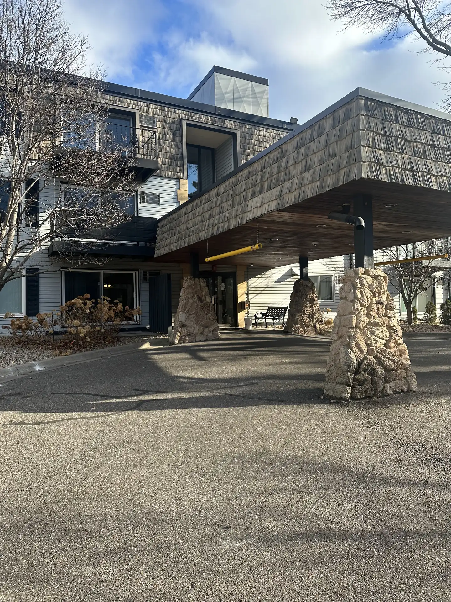 Stone pillars and entrance canopy of the office building at 183 Little Canada Rd E, Little Canada, Minnesota