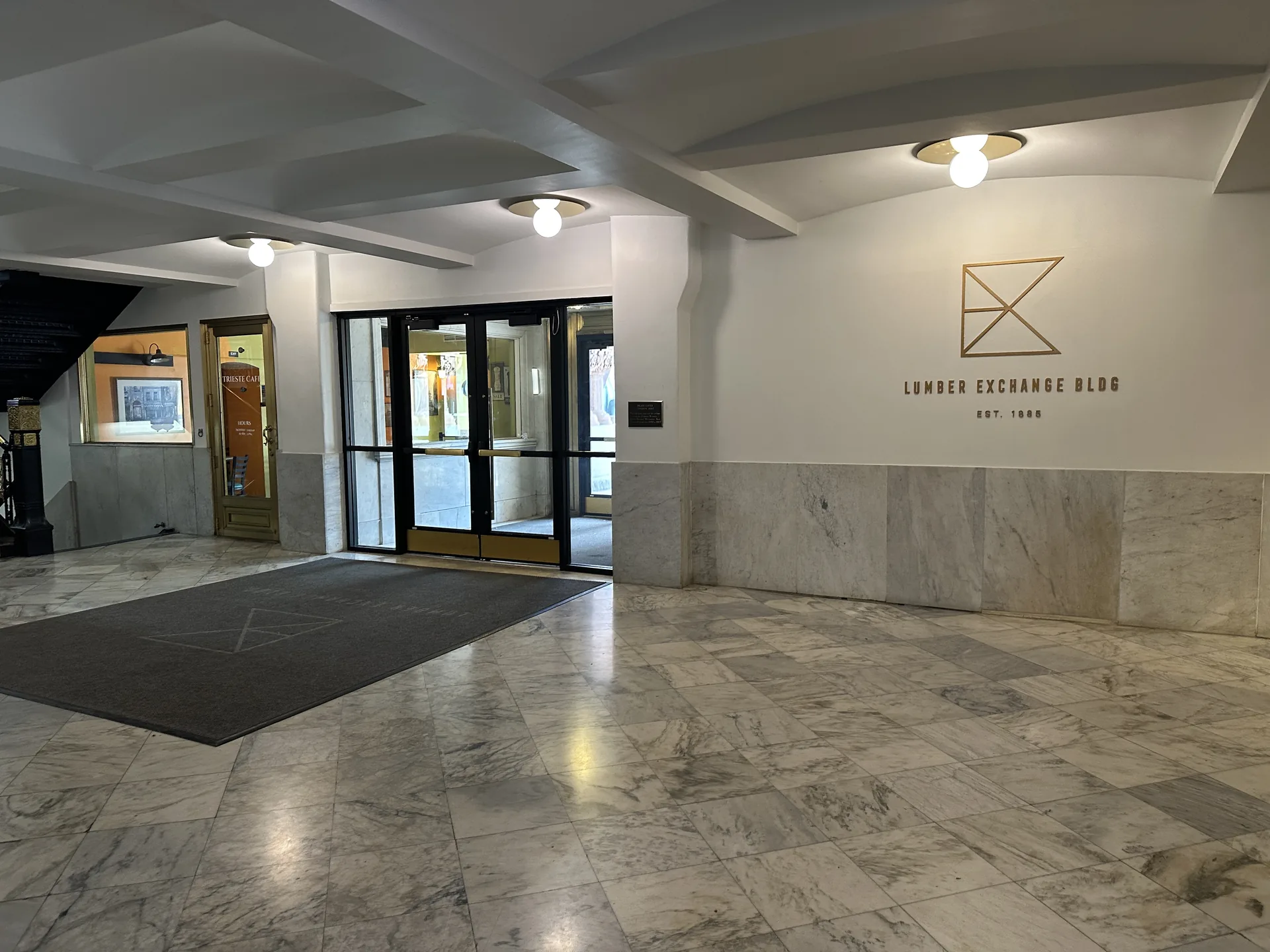 Marble lobby and street entrance of the building at 10 S 5th St, Minneapolis, where Andrade Law's office is located