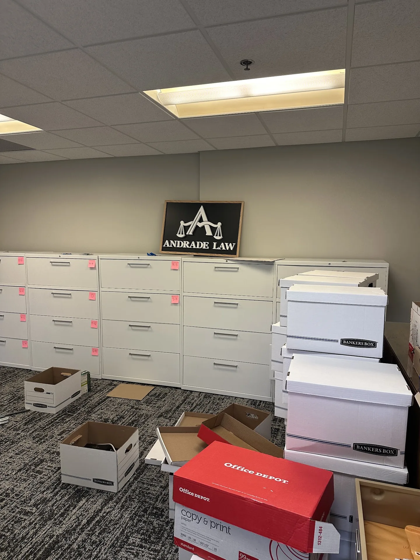 Records room at Andrade Law's Minneapolis office with the firm's sign