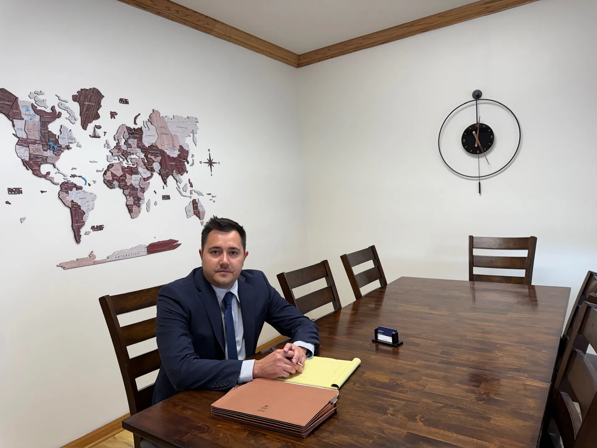 Attorney Gabe Andrade seated at the conference table in the Andrade Law office in Saint Paul, Minnesota