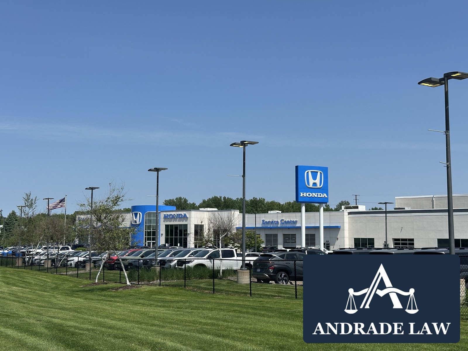 Buerkle Honda campus on Highway 61 in Vadnais Heights, Minnesota, with Andrade Law branding