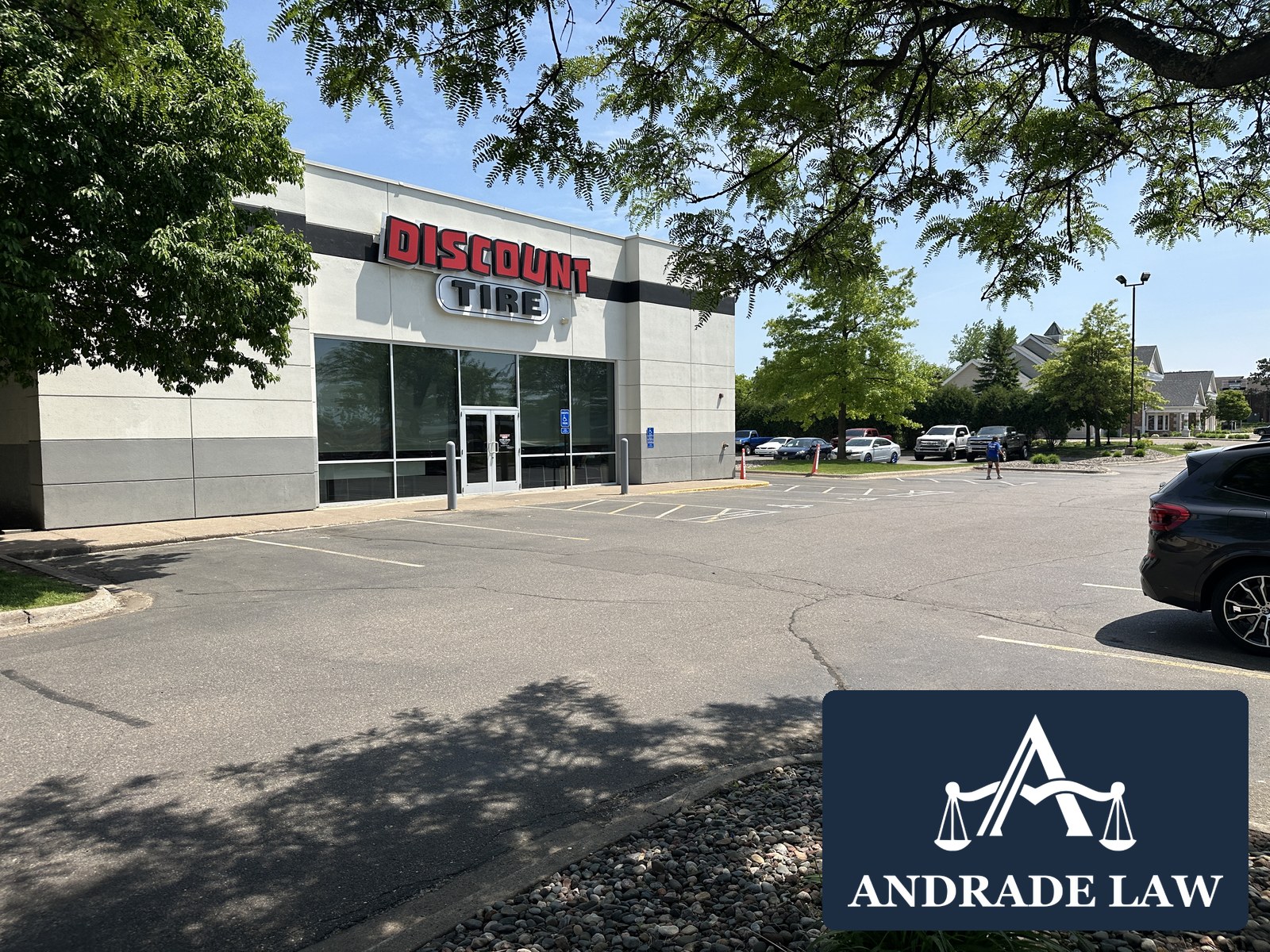 Discount Tire store on White Bear Avenue in Maplewood with Andrade Law branding