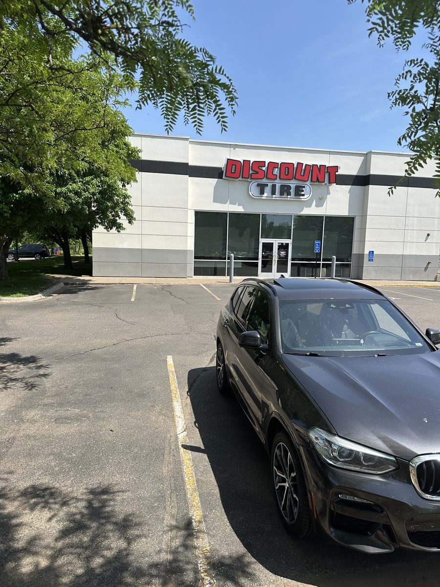 Discount Tire storefront and customer parking at 2570 White Bear Ave N in Maplewood, Minnesota