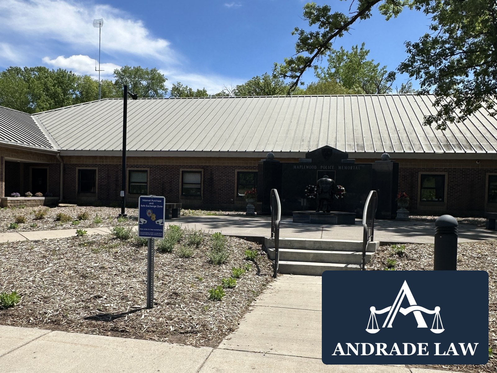 Maplewood City Hall and the Maplewood Police Memorial plaza with Andrade Law branding