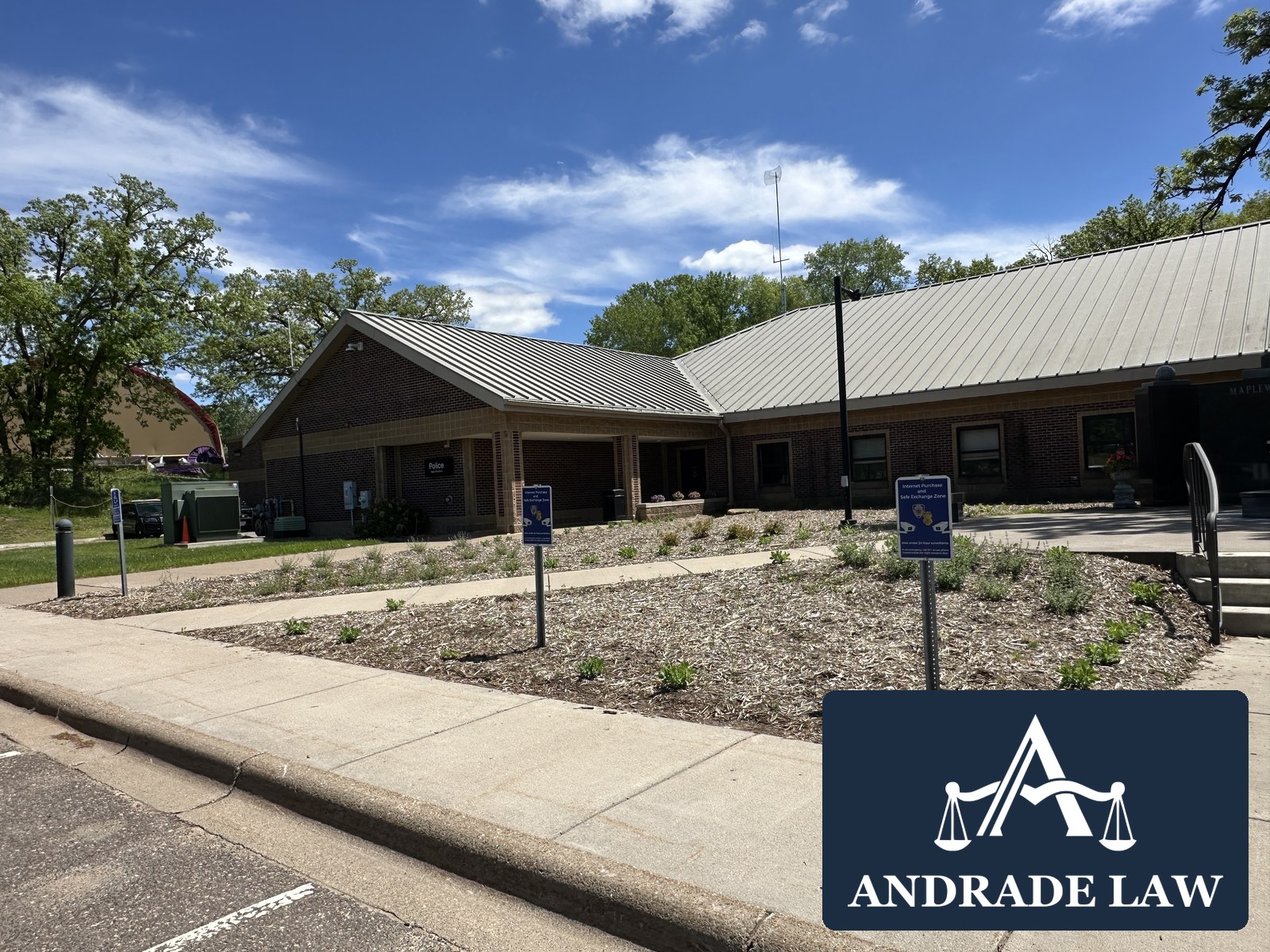 Maplewood Police Department building exterior with Andrade Law branding