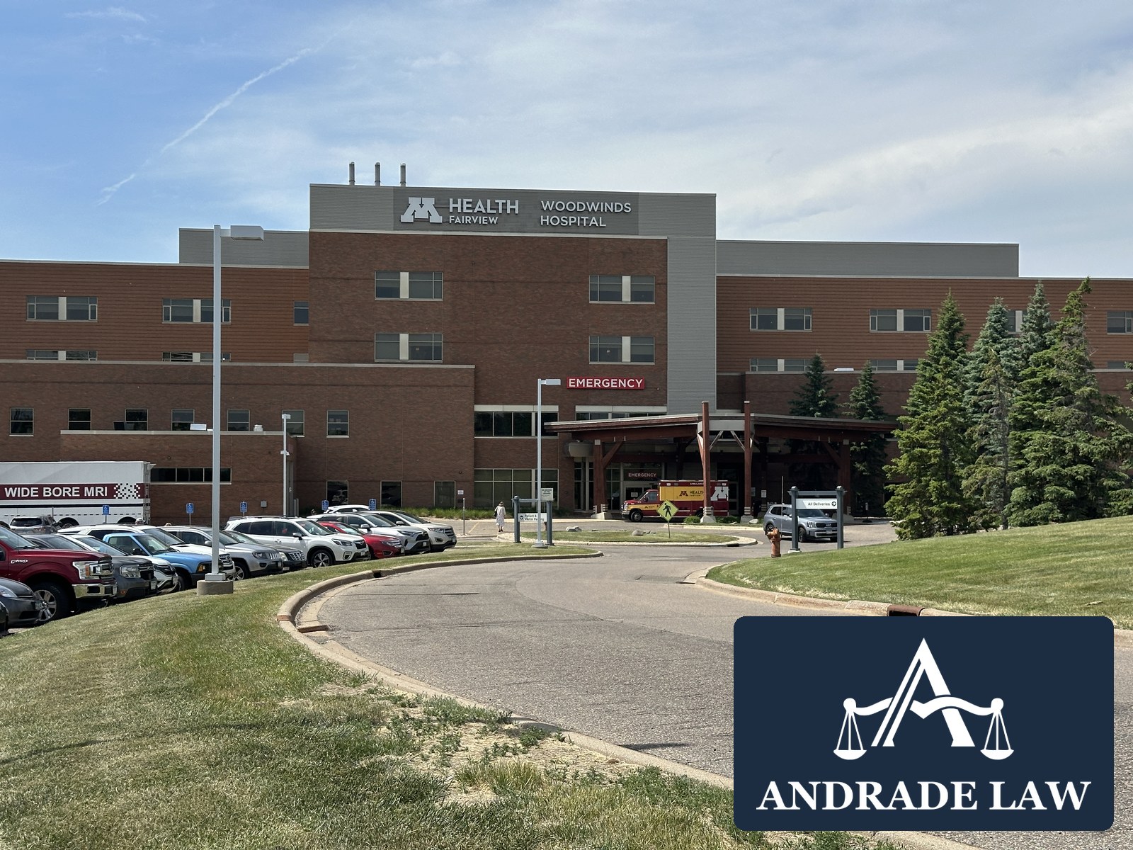 M Health Fairview Woodwinds Hospital exterior with Andrade Law branding