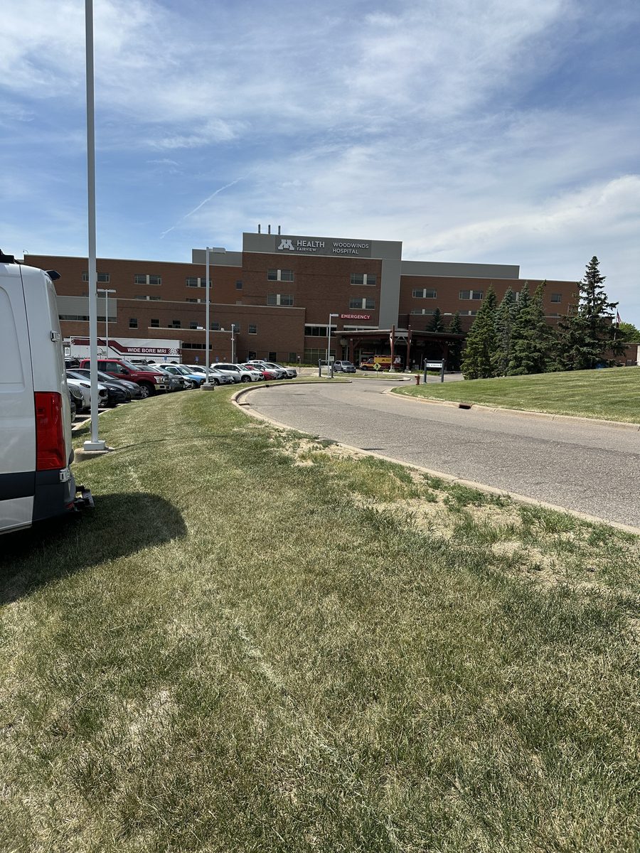 M Health Fairview Woodwinds Hospital main building above the visitor approach road in Woodbury, Minnesota