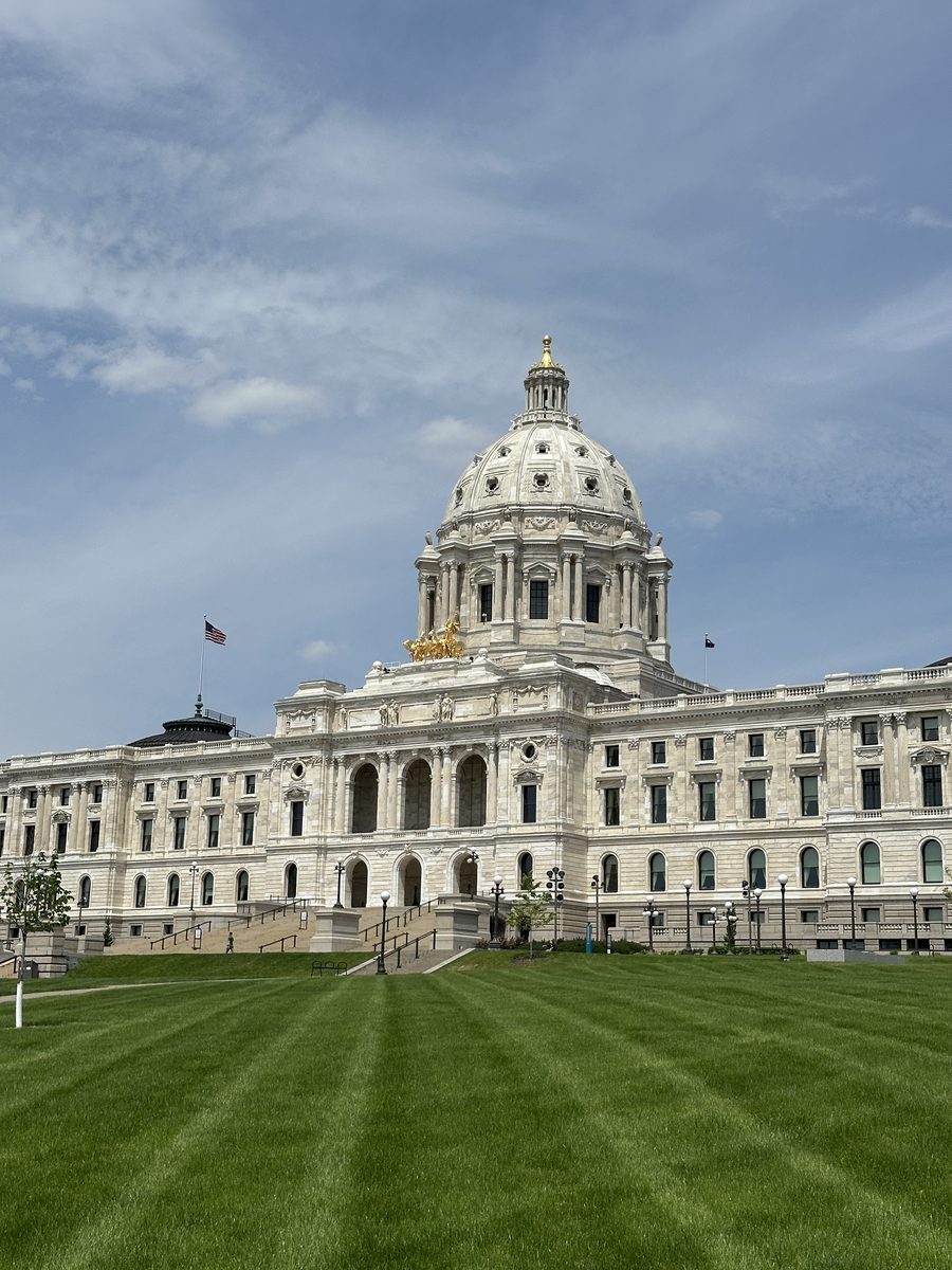 South facade of the Minnesota State Capitol with the golden Quadriga above the entrance, across the front lawn