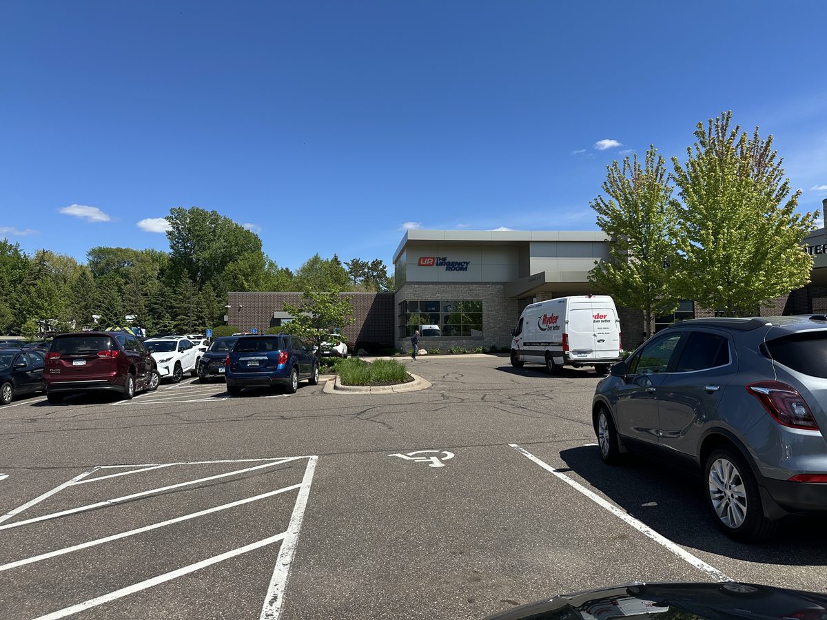 Patient parking and entrance of The Urgency Room in Vadnais Heights, Minnesota, which houses on-site CT, X-ray, ultrasound, and lab services